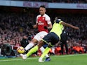 Arsenal's Pierre-Emerick Aubameyang in action with Huddersfield Town's Terence Kongolo on December 8, 2018