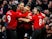 Manchester United's Ashley Young celebrates with teammates after opening the scoring against Fulham on December 8, 2018