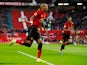 Manchester United's Ashley Young celebrates after opening the scoring against Fulham on December 8, 2018