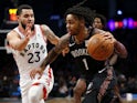 Brooklyn Nets' D'Angelo Russell takes on Toronto Raptors' Fred VanVleet on December 7, 2018