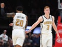 Atlanta Hawks forward John Collins (20) and Atlanta Hawks guard Kevin Huerter (3) celebrate after a basket during the second half against the Denver Nuggets at State Farm Arena