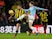 John Stones and Troy Deeney in action during the Premier League game between Manchester City and Watford on December 4, 2018