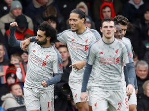 Salah hat-trick sends Liverpool top