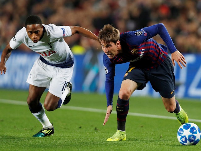 Barcelona's Juan Miranda tussles with Tottenham Hotspur's Kyle Walker-Peters on December 11, 2018.