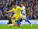 Eden Hazard and Dale Stephens in action during the Premier League game between Brighton & Hove Albion and Chelsea on December 16, 2018