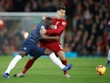 Eric Bailly and Roberto Firmino in action during the Premier League game between Liverpool and Manchester United on December 16, 2018