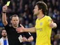 Chelsea's Marcos Alonso is issued with a yellow card on December 16, 2018