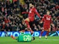 Liverpool's Mohamed Salah attempts to win the ball ahead of Napoli's David Ospina on December 11, 2018