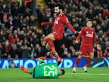 Liverpool's Mohamed Salah attempts to win the ball ahead of Napoli's David Ospina on December 11, 2018