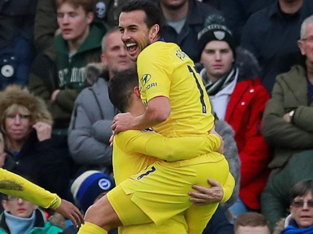Pedro embraces Eden Hazard after scoring during the Premier League game between Brighton & Hove Albion and Chelsea on December 16, 2018