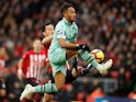 Pierre-Emerick Aubameyang and Maya Yoshida in action during the Premier League game between Southampton and Arsenal on December 16, 2018