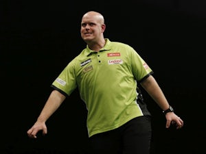 Van Gerwen withstands Aspinall comeback to win World Grand Prix