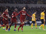 Liverpool striker Mohamed Salah celebrates after scoring the opening goal against Wolverhampton Wanderers on December 21, 2018