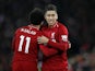 Liverpool striker Roberto Firmino celebrates with Mohamed Salah after scoring against Arsenal on December 29, 2018