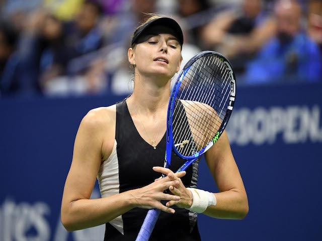 Result: Maria Sharapova consoles opponent Wang Xinyu after injury forces her to retire