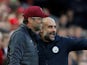 Manchester City manager Pep Guardiola speaks to Liverpool boss Jurgen Klopp during their Premier League clash at Anfield on October 7, 2018