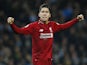 Roberto Firmino celebrates getting an equaliser during the Premier League game between Manchester City and Liverpool on January 3, 2019