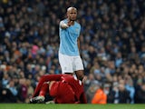 Vincent Kompany takes down Mo Salah during the Premier League game between Manchester City and Liverpool on January 3, 2019