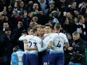 Tottenham Hotspur striker Harry Kane celebrates with teammates after opening the scoring against Chelsea in their EFL Cup semi-final on January 8, 2019