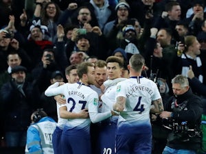 Tottenham Hotspur striker Harry Kane celebrates with teammates after opening the scoring against Chelsea in their EFL Cup semi-final on January 8, 2019