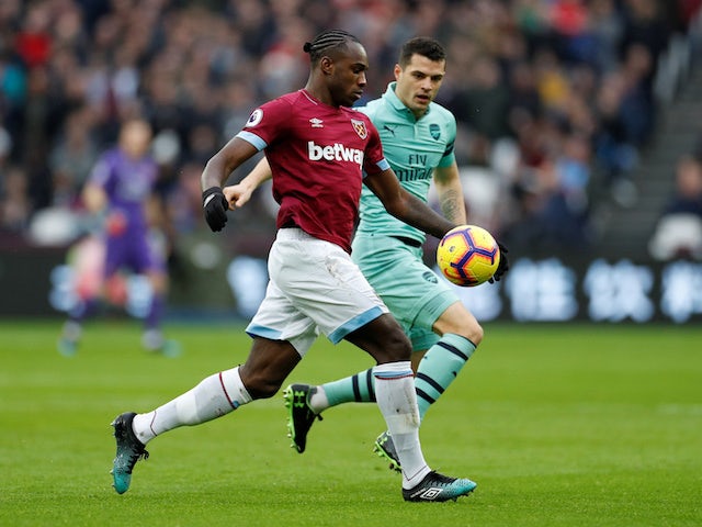 West Ham United's Michail Antonio is chased by Arsenal's Granit Xhaka during their Premier League clash on January 12, 2019