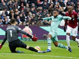 West Ham goalkeeper Lukasz Fabianski thwarts Arsenal striker Alexandre Lacazette during their Premier League clash on January 12, 2019