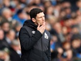 Huddersfield Town boss Mark Hudson watches on during his side's Premier League clash with Manchester City on January 20, 2019