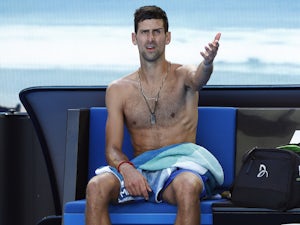Djokovic pleased to progress on a "challenging" day