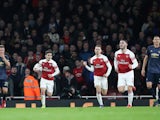 Arsenal's players react to Pierre-Emerick Aubameyang's goal against Manchester United on January 25, 2019