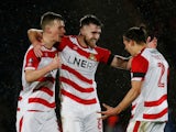 Ben Whiteman celebrates with teammates after scoring for Doncaster Rovers on January 26, 2019
