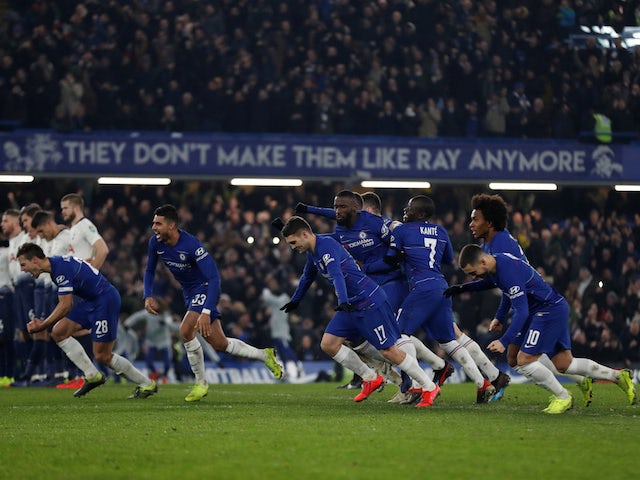 Chelsea players celebrate their penalty shootout win against Tottenham Hotspur in the EFL Cup on January 24, 2019
