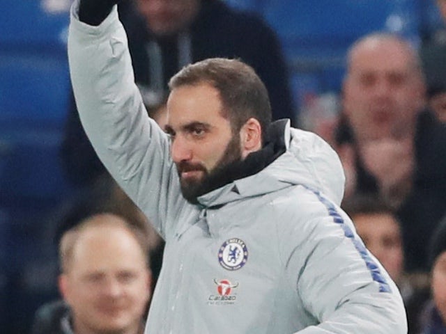 New Chelsea signing Gonzalo Higuain waves to the crowd ahead of the EFL Cup semi-final against Tottenham Hotspur on January 24, 2019