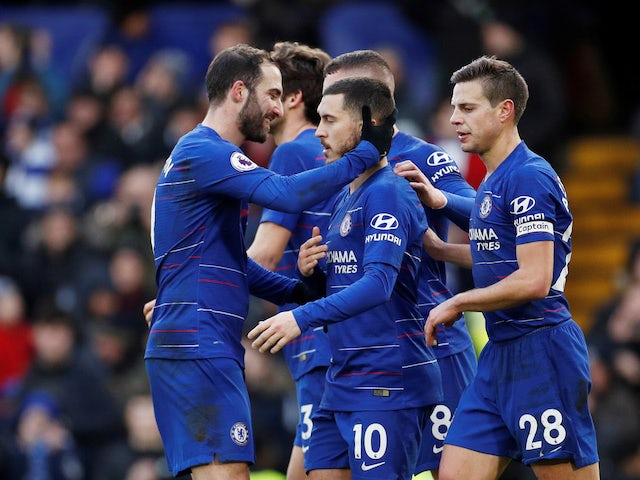 Chelsea's Eden Hazard celebrates with teammates after scoring against Huddersfield on February 2, 2019