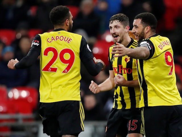 Watford's Craig Cathcart celebrates scoring the opening goal against Tottenham Hotspur in the Premier League on January 30, 2019.
