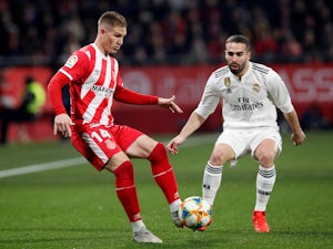 Real Madrid's Dani Carvajal in action with Girona's Raul Garcia in the Copa del Rey on January 31, 2019