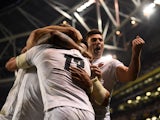 England players celebrate after scoring a try against Ireland in the Six Nations on February 2, 2019
