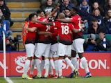 Manchester United players celebrate scoring against Leicester City in their Premier League clash on February 3, 2019