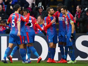 Crystal Palace midfielder Luka Milivojevic celebrates with teammates after scoring against Fulham on February 2, 2019