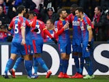 Crystal Palace midfielder Luka Milivojevic celebrates with teammates after scoring against Fulham on February 2, 2019