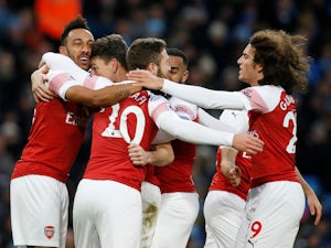 Arsenal's players celebrate after scoring against Manchester City in the Premier League on February 3, 2019