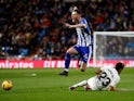 Alaves attacker Burgui jumps over Real Madrid's Sergio Reguilon in La Liga on February 3, 2019