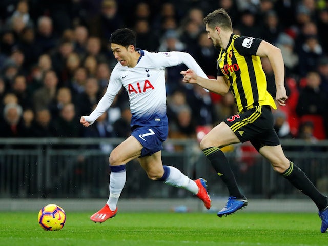 Tottenham Hotspur's Son-Heung min attempts to dribble away from Watford's Craig Cathcart in the Premier League on January 30, 2019.