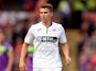Tom Carroll pictured playing for Swansea in August 2018