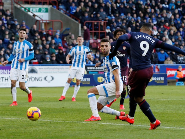 Alexandre Lacazette scores Arsenal's second goal against Huddersfield Town in the Premier League on February 9, 2019.