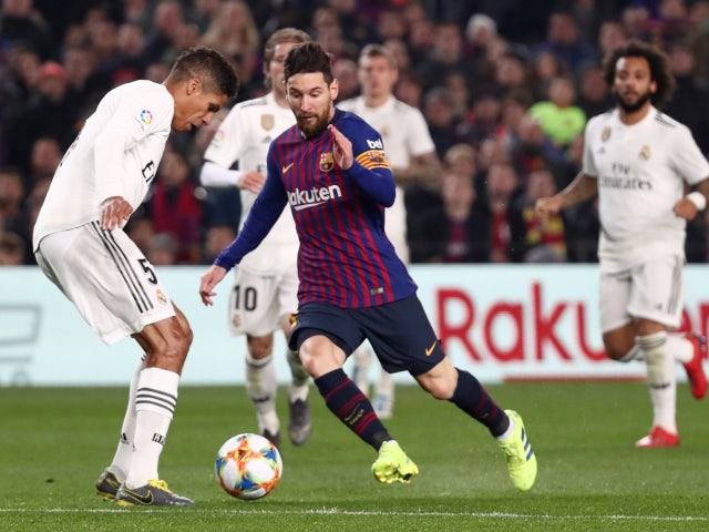 Barcelona forward Lionel Messi is crowded out by Real Madrid players on February 6, 2019