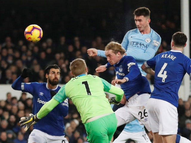 Manchester City's Aymeric Laporte rises above the Everton defence in the Premier League on February 6, 2019.