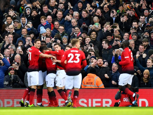 Manchester United players celebrate the opening goal against Fulham on February 9, 2019