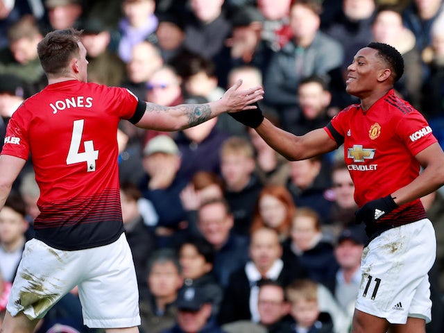 Anthony Martial celebrates with Manchester United teammate Phil Jones after scoring during his side's Premier League clash with Fulham on February 9, 2019