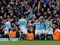 Ilkay Gundogan is mobbed by his Manchester City teammates after scoring his side's fourth goal against Chelsea on February 10, 2019