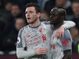 Liverpool forward Sadio Mane celebrates with Andrew Robertson after scoring in the Premier League clash with West Ham United on February 4, 2019